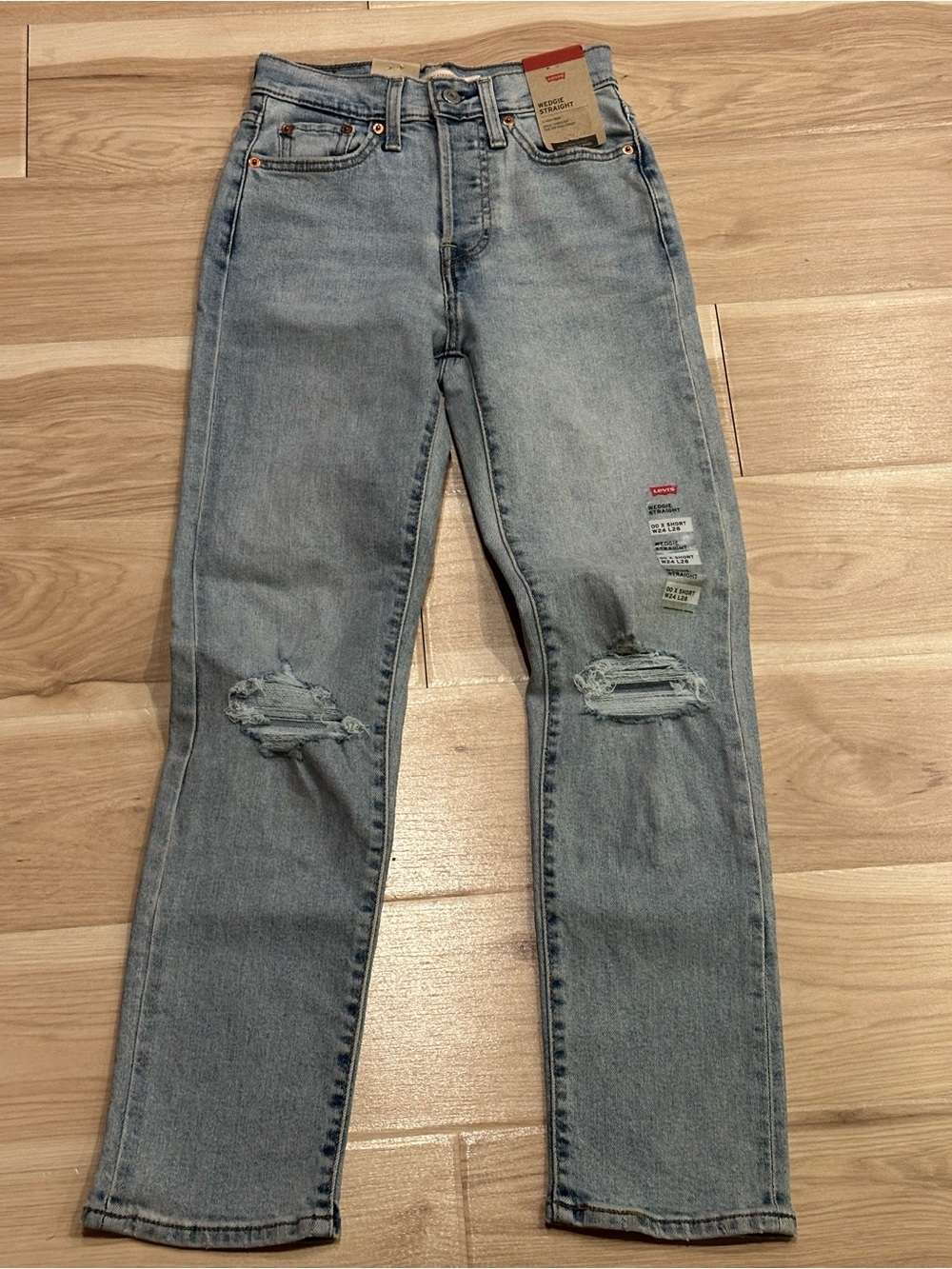 Levi's Women's Light Wash Slim Straight Jeans with Knee Rips